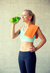 Image showing woman with bottle of water in gym