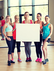 Image showing - group of women witn white blank billboard