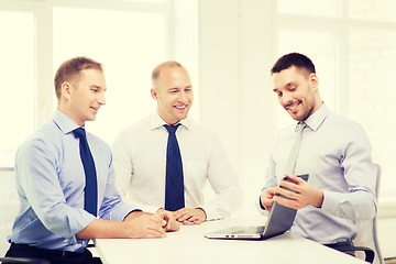 Image showing business team working with laptop in office