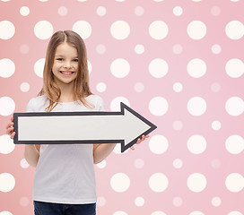 Image showing smiling girl with blank arrow pointing right