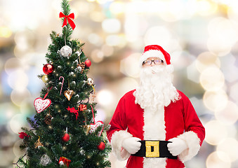 Image showing man in costume of santa claus with christmas tree