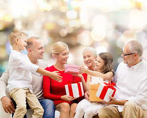 Image showing smiling family with gifts