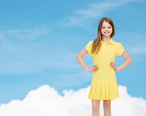 Image showing smiling little girl in yellow dress