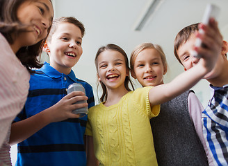 Image showing group of school kids with smartphone and soda can