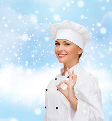 Image showing smiling female chef showing ok hand sign