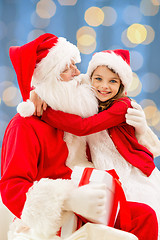 Image showing smiling little girl with santa claus