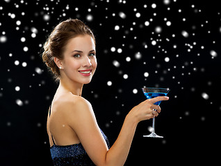 Image showing smiling woman holding cocktail