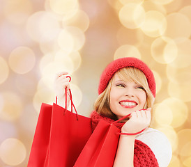 Image showing smiling young woman with shopping bags