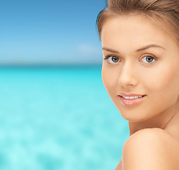 Image showing beautiful young woman over blue sky and sea