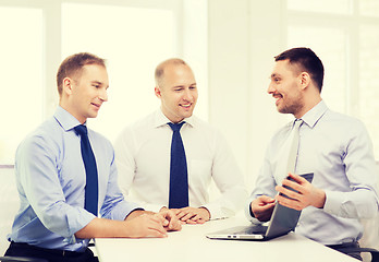 Image showing business team working with laptop in office