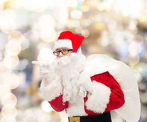 Image showing man in costume of santa claus with bag