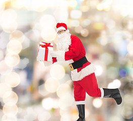 Image showing man in costume of santa claus with gift box