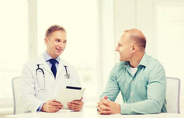 Image showing doctor with tablet pc and patient in hospital