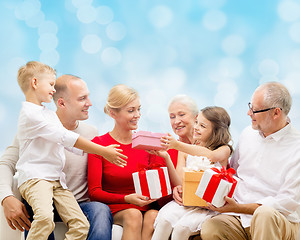 Image showing smiling family with gifts