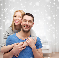 Image showing happy couple hugging at home