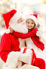 Image showing smiling little girl with santa claus