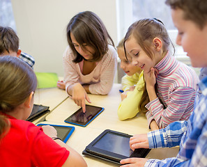 Image showing group of school kids with tablet pc in classroom