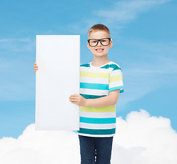 Image showing smiling boy in eyeglasses with white blank board