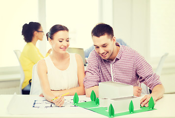 Image showing smiling architects working in office