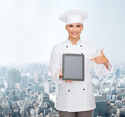 Image showing smiling female chef with tablet pc blank screen