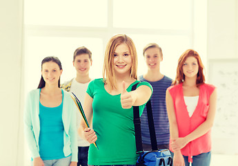 Image showing smiling students with teenage girl in front