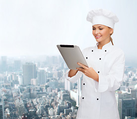 Image showing smiling female chef with tablet pc computer