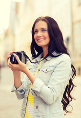 Image showing smiling teenage girl with camera