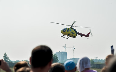 Image showing People waiting of landing Eurocopter