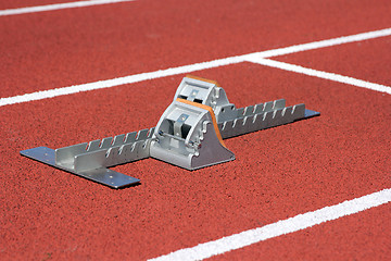 Image showing Athletics starting blocks on race track