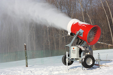 Image showing Snowmaking is the production of snow  on ski slopes. 