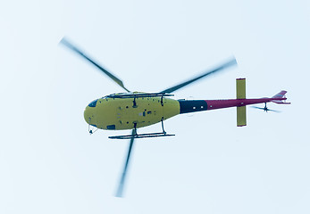 Image showing Pilot of Eurocopter AS-350 on airshow. Bottom view