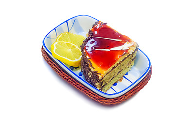 Image showing Cake and slices of lemon on a white background.