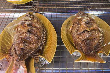 Image showing Fish with lettuce on blyude.Ekzoticheskaya food and drink in South East Asia.