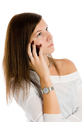 Image showing Pretty woman talking by mobile phone