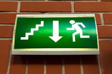 Image showing Green emergency exit sign 