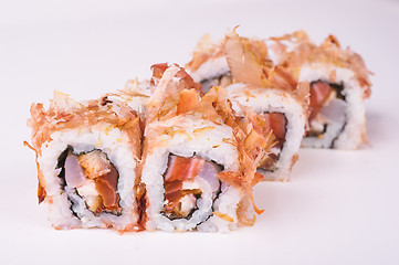 Image showing salmon sushi roll in tuna flakes 