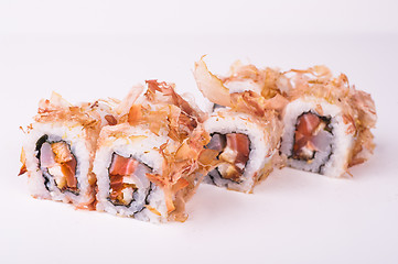 Image showing salmon sushi roll in tuna flakes 