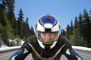 Image showing Motorcyclist on mountain road