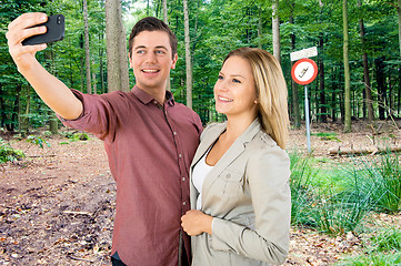 Image showing Couple taking a selfie in a No Cell phone area