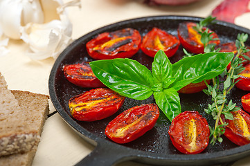 Image showing baked cherry tomatoes with basil and thyme