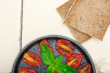 Image showing baked cherry tomatoes with basil and thyme