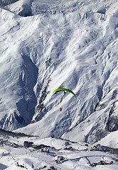 Image showing Speed flying in snow mountains at sun day