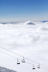 Image showing Mountains under clouds and chair-lift