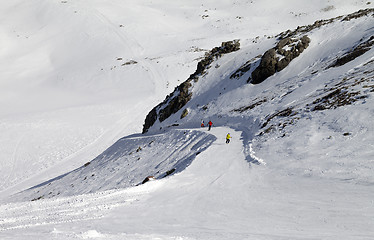 Image showing Snowboarders and skiers on ski slope