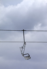 Image showing Chair-lift and gray sky