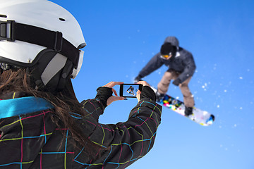 Image showing Photographed snowboarder jump with cell phone