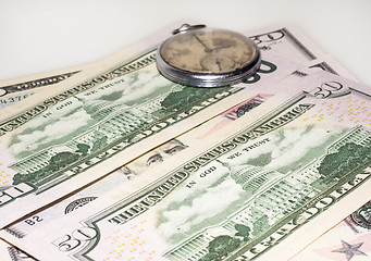 Image showing Some dollars and old watch 