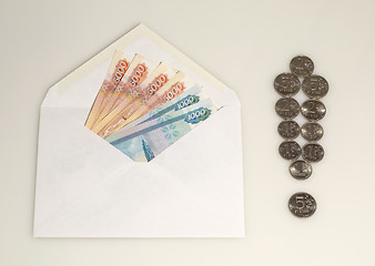 Image showing Money in envelope and exclamation mark from coins