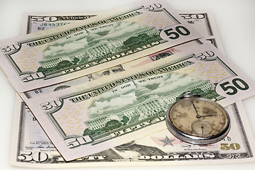 Image showing Dollar bank bills and old watch