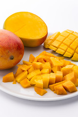 Image showing Loose Cubes Of Mango Fruit Flesh And Scored Pulp